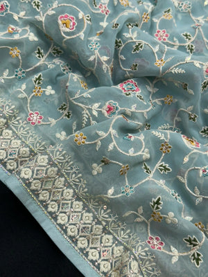 Woman wearing a Semi Georgette Silk Saree with a soft flowing drape and subtle shine, ideal for festive and formal occasions.