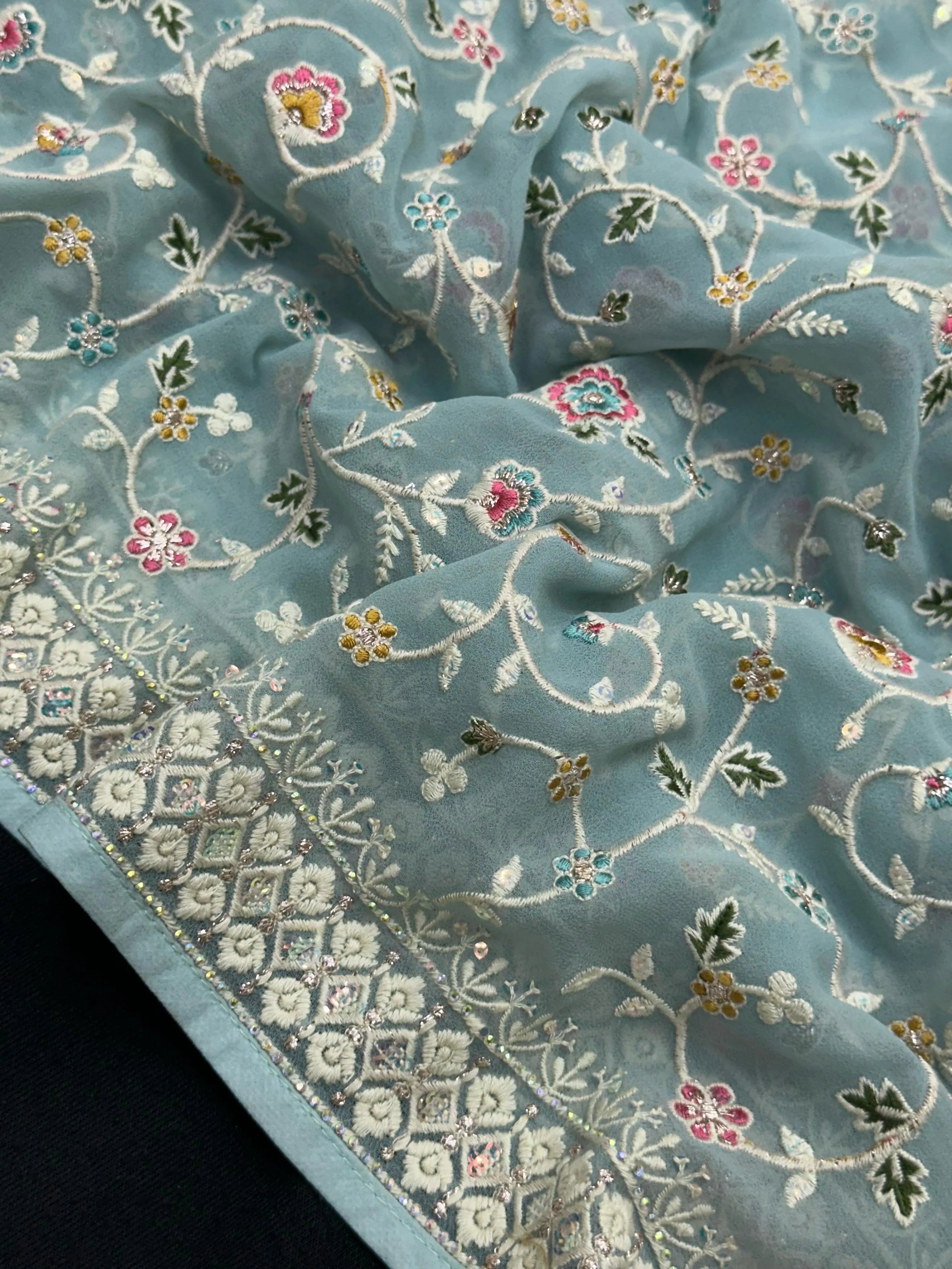 Woman wearing a Semi Georgette Silk Saree with a soft flowing drape and subtle shine, ideal for festive and formal occasions.