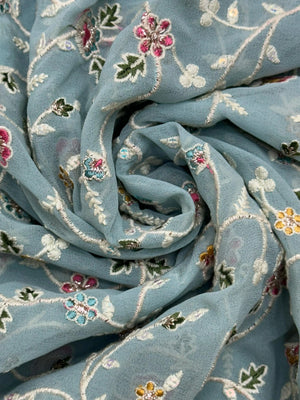 Woman wearing a Semi Georgette Silk Saree with a soft flowing drape and subtle shine, ideal for festive and formal occasions.