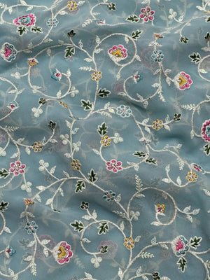 Woman wearing a Semi Georgette Silk Saree with a soft flowing drape and subtle shine, ideal for festive and formal occasions.