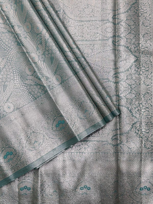Semi Kanjivaram silk saree with zari border and traditional motifs – ideal for weddings and festive wear