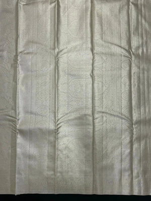 Semi Kanjivaram silk saree with zari border and traditional motifs – ideal for weddings and festive wear