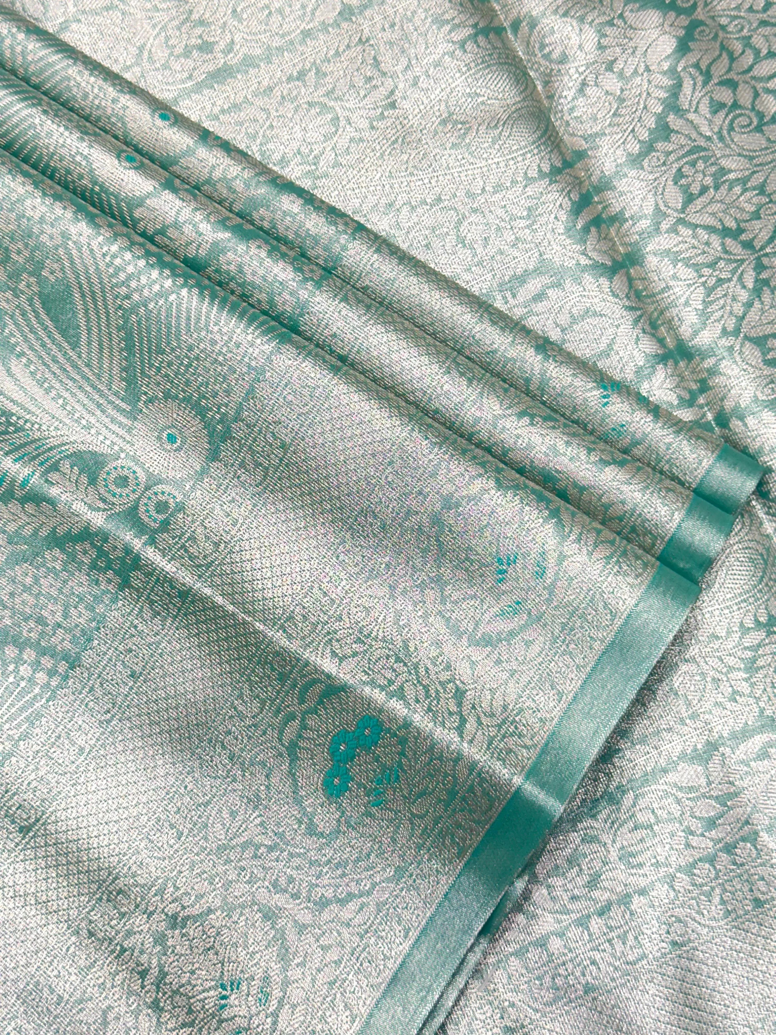 Semi Kanjivaram silk saree with zari border and traditional motifs – ideal for weddings and festive wear