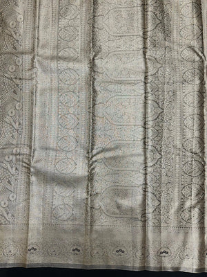 Semi Kanjivaram silk saree with zari border and traditional motifs – ideal for weddings and festive wear