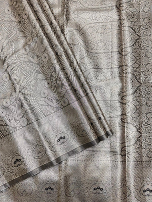 Semi Kanjivaram silk saree with zari border and traditional motifs – ideal for weddings and festive wear