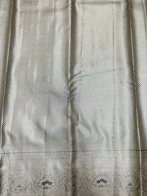 Semi Kanjivaram silk saree with zari border and traditional motifs – ideal for weddings and festive wear