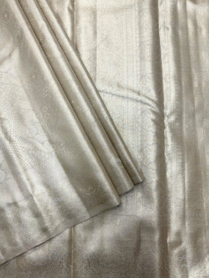 Semi Kanjivaram silk saree with zari border and traditional motifs – ideal for weddings and festive wear