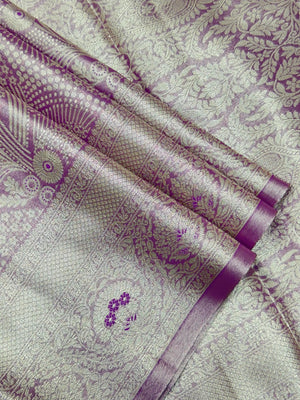 Semi Kanjivaram silk saree with zari border and traditional motifs – ideal for weddings and festive wear