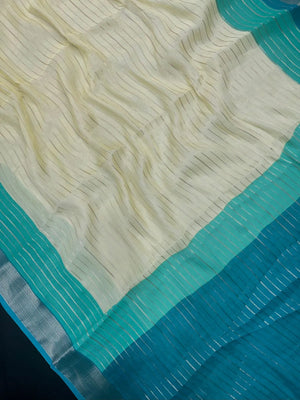 Woman wearing a Semi Silk Saree with elegant shine and festive border – perfect for ethnic functions and special occasions.