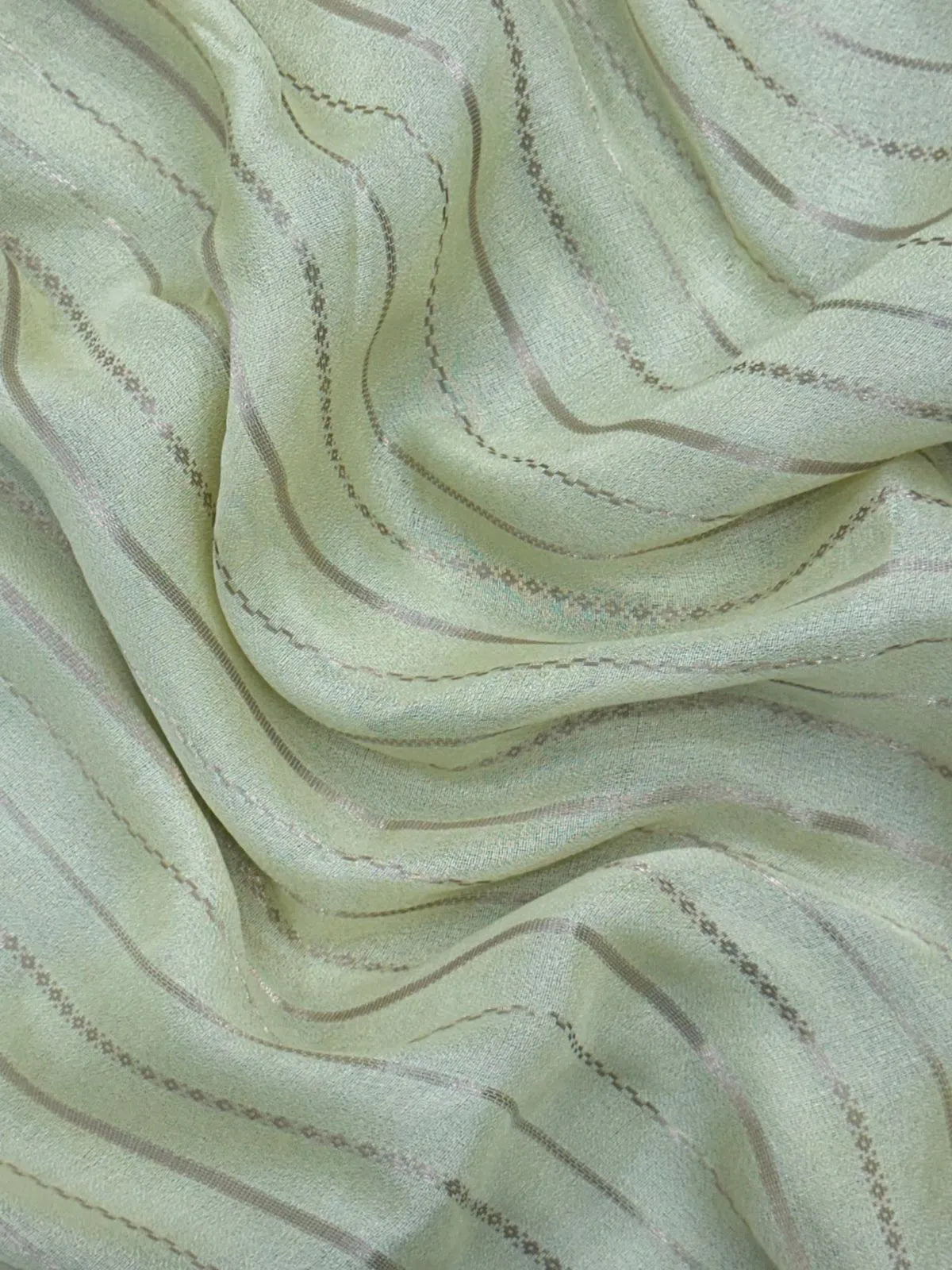 Woman wearing a Semi Silk Saree with elegant shine and festive border – perfect for ethnic functions and special occasions.