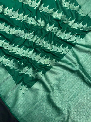 Woman wearing a Semi Silk Saree with smooth, shiny finish and lightweight fabric, ideal for festive and everyday occasions.