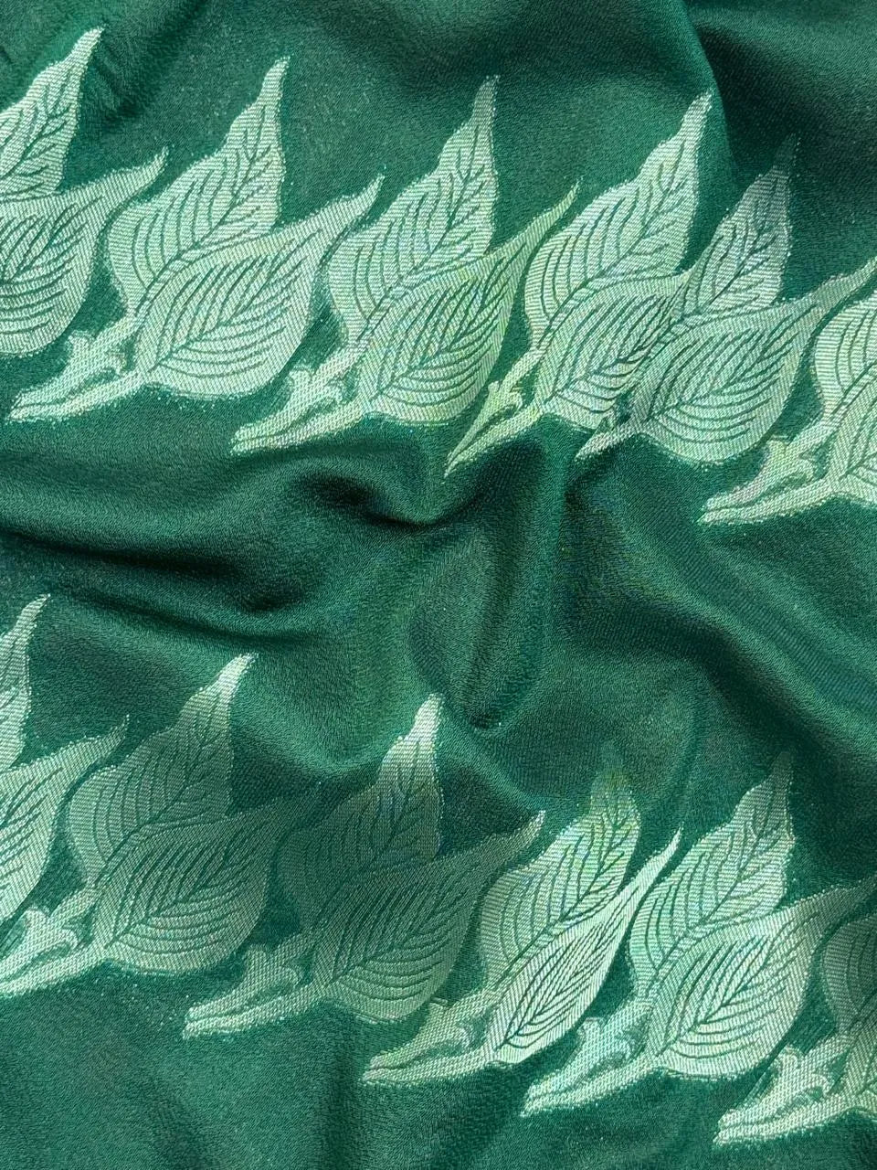 Woman wearing a Semi Silk Saree with smooth, shiny finish and lightweight fabric, ideal for festive and everyday occasions.