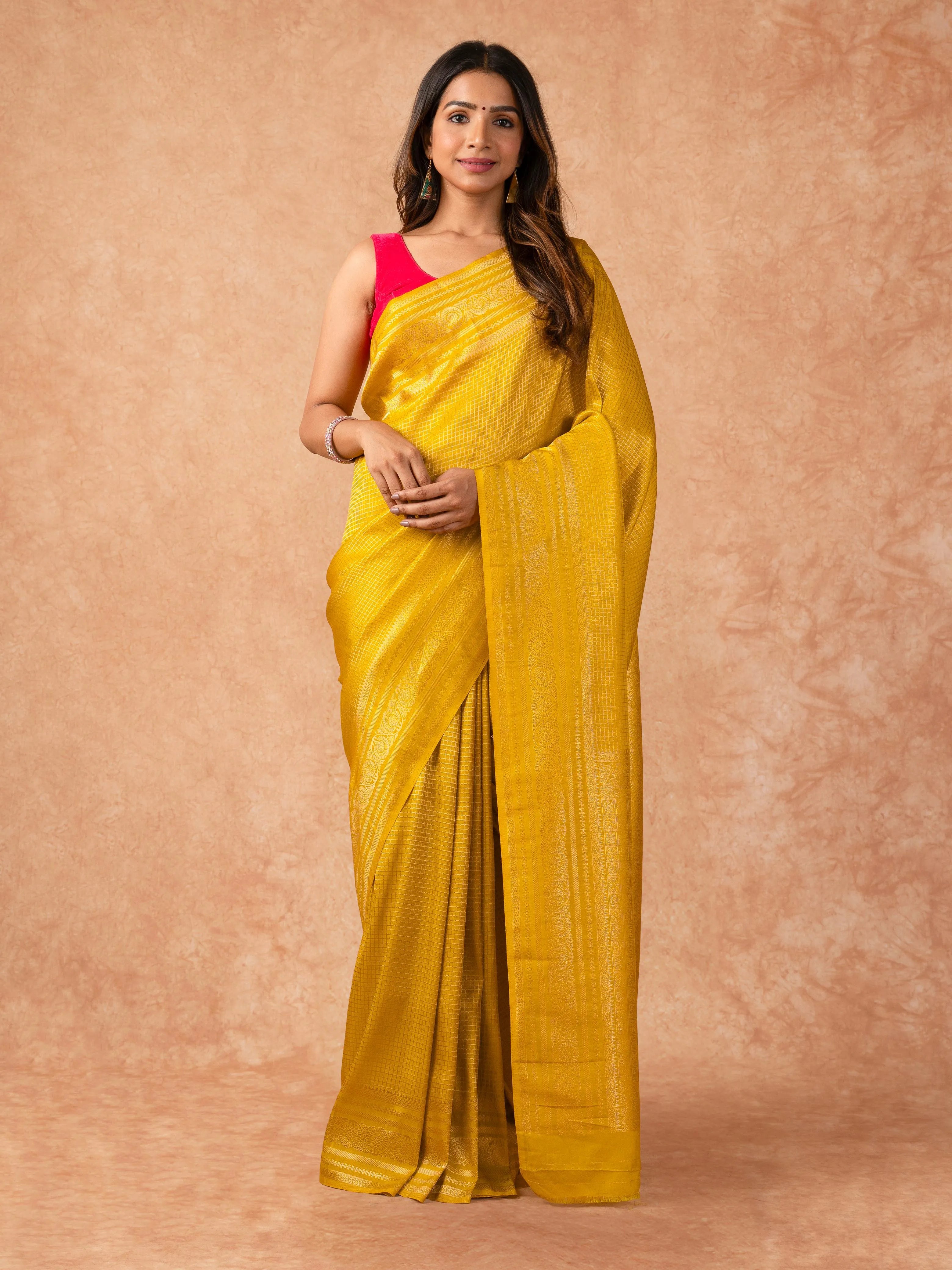 Woman wearing a Semi Silk Saree with lightweight drape and subtle shine, ideal for office wear, family gatherings, and festive occasions.