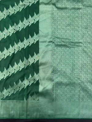 Woman wearing a Semi Silk Saree with smooth, shiny finish and lightweight fabric, ideal for festive and everyday occasions.