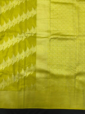 Woman wearing a Semi Silk Saree with smooth, shiny finish and lightweight fabric, ideal for festive and everyday occasions.