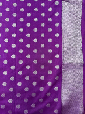 Woman wearing a Semi Silk Saree with smooth, shiny finish and lightweight fabric, ideal for festive and everyday occasions.