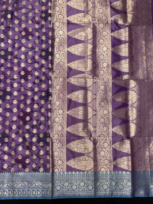 Woman wearing a Semi Silk Saree with lightweight fabric and soft sheen, ideal for weddings, festive occasions, and office wear.