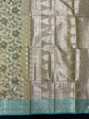 Woman wearing a Semi Silk Saree with lightweight fabric and soft sheen, ideal for weddings, festive occasions, and office wear.