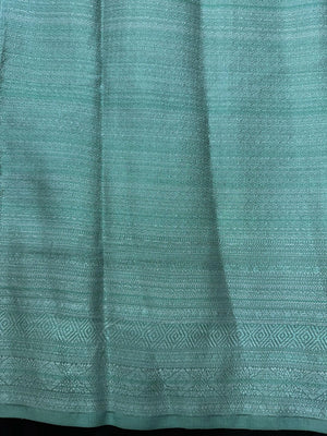 Woman wearing a Semi Silk Saree with a soft shine and lightweight drape, ideal for everyday elegance and traditional style.