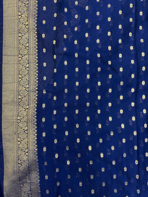 Woman wearing a Semi Chiffon Saree with lightweight, flowing fabric and subtle shine, perfect for weddings, parties, and office wear.