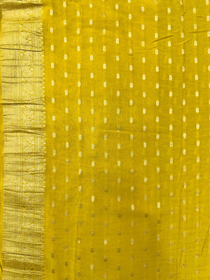 Woman wearing a Semi Chiffon Saree with lightweight, flowing fabric and subtle shine, perfect for weddings, parties, and office wear.