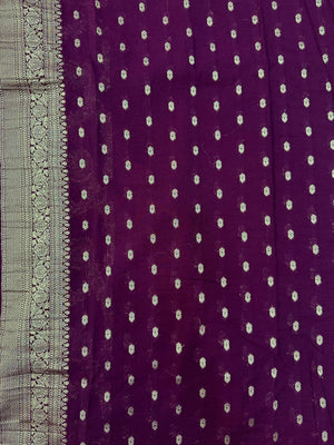 Woman wearing a Semi Chiffon Saree with lightweight, flowing fabric and subtle shine, perfect for weddings, parties, and office wear.