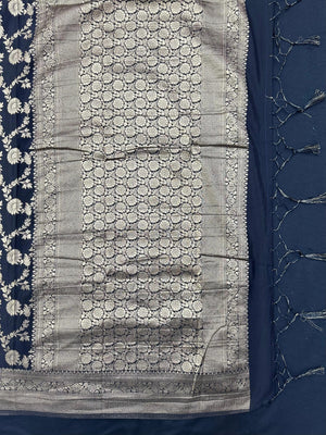 Woman wearing a Semi Chiffon Saree with lightweight, flowing fabric and subtle shine, perfect for weddings, parties, and office wear.