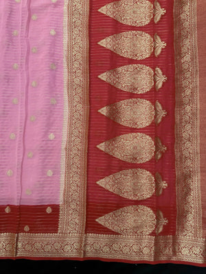 “Woman draped in a Semi Khaddi Georgette saree featuring intricate Banarasi motifs and a soft, flowy texture—perfect blend of tradition and lightness.”