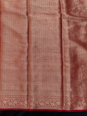 “Woman draped in a Semi Khaddi Georgette saree featuring intricate Banarasi motifs and a soft, flowy texture—perfect blend of tradition and lightness.”