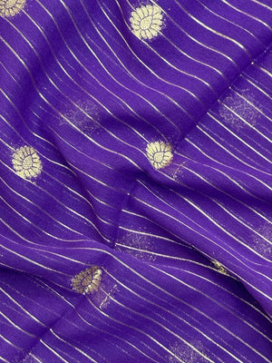 “Woman draped in a Semi Khaddi Georgette saree featuring intricate Banarasi motifs and a soft, flowy texture—perfect blend of tradition and lightness.”