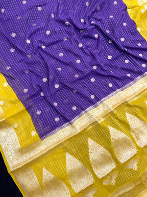 “Woman draped in a Semi Khaddi Georgette saree featuring intricate Banarasi motifs and a soft, flowy texture—perfect blend of tradition and lightness.”