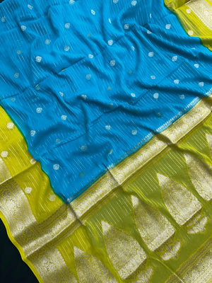 “Woman draped in a Semi Khaddi Georgette saree featuring intricate Banarasi motifs and a soft, flowy texture—perfect blend of tradition and lightness.”