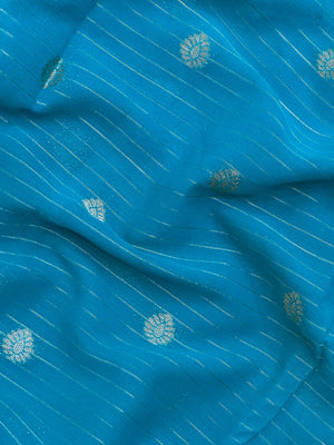 “Woman draped in a Semi Khaddi Georgette saree featuring intricate Banarasi motifs and a soft, flowy texture—perfect blend of tradition and lightness.”