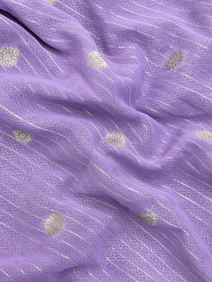 “Woman draped in a Semi Khaddi Georgette saree featuring intricate Banarasi motifs and a soft, flowy texture—perfect blend of tradition and lightness.”