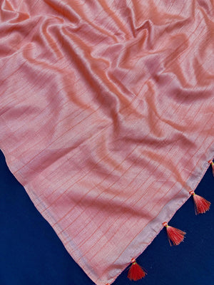 Woman draped in a Soft Tussar Silk Saree with subtle shine and fluid texture, ideal for elegant everyday and festive occasions.