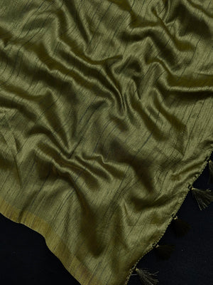 Woman draped in a Soft Tussar Silk Saree with subtle shine and fluid texture, ideal for elegant everyday and festive occasions.