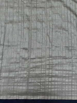 Woman draped in a Soft Tussar Silk Saree with subtle shine and fluid texture, ideal for elegant everyday and festive occasions.