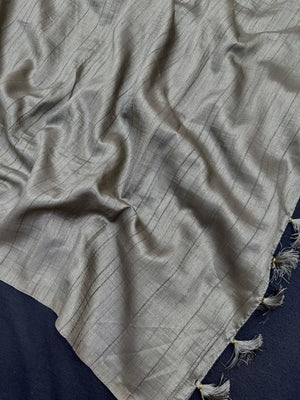 Woman draped in a Soft Tussar Silk Saree with subtle shine and fluid texture, ideal for elegant everyday and festive occasions.