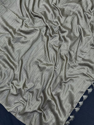 Woman draped in a Soft Tussar Silk Saree with subtle shine and fluid texture, ideal for elegant everyday and festive occasions.