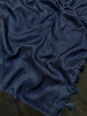 Woman draped in a Soft Tussar Silk Saree with subtle shine and fluid texture, ideal for elegant everyday and festive occasions.