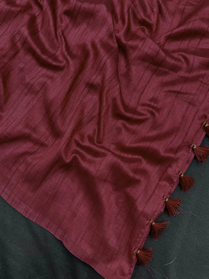 Woman draped in a Soft Tussar Silk Saree with subtle shine and fluid texture, ideal for elegant everyday and festive occasions.