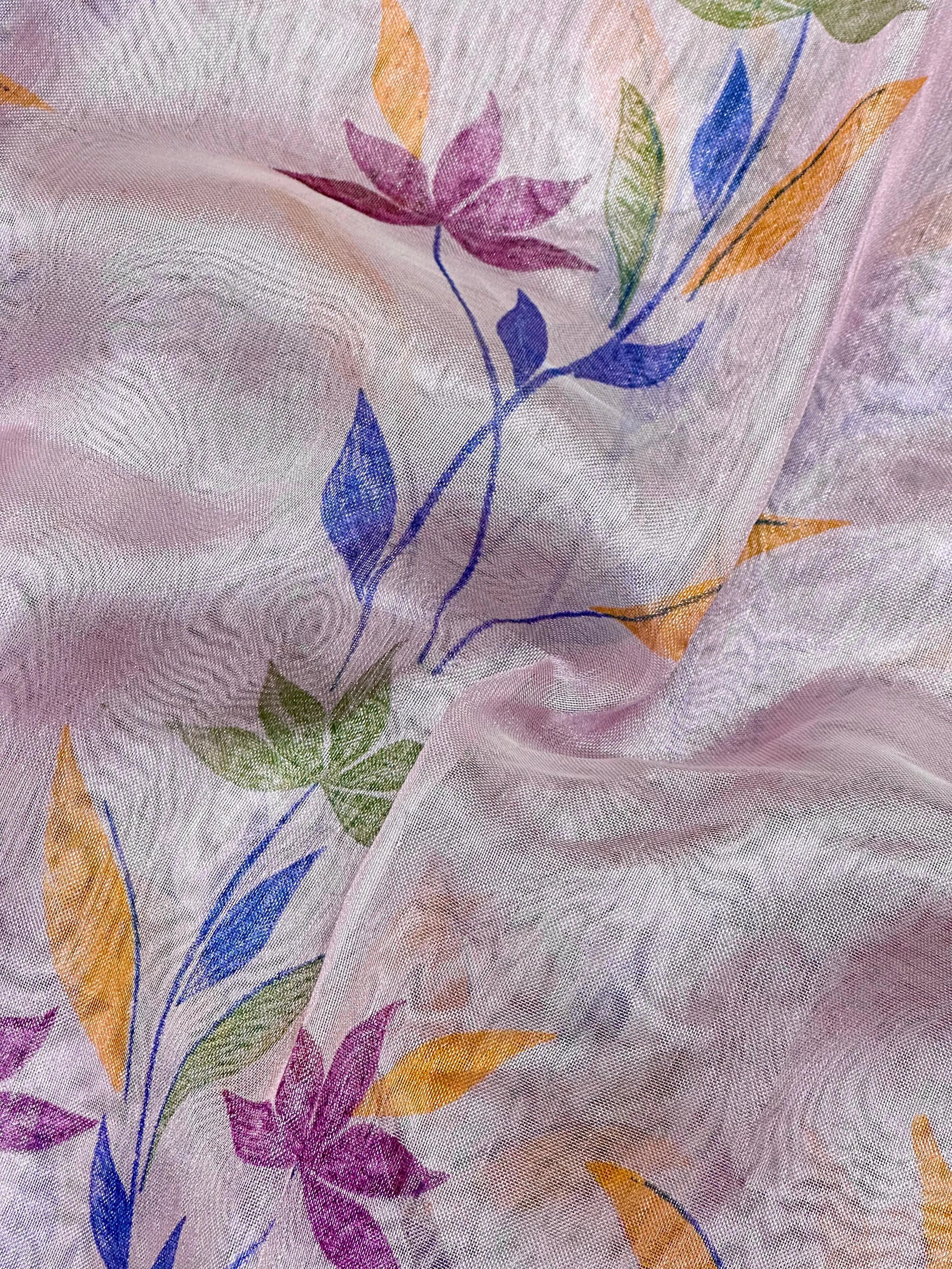 Woman in a shimmering Tissue Silk Saree with soft gold sheen, perfect for weddings and festive events.