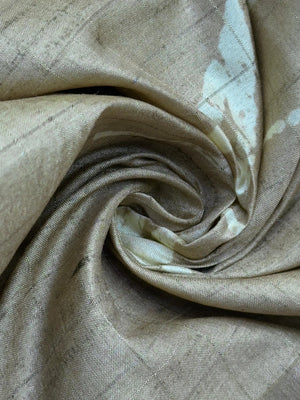 “Woman wearing a lightweight Tussar silk saree in earthy tones, featuring a soft natural sheen and subtle patterns—ideal for elegant daily wear.”