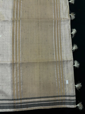 “Woman wearing a lightweight Tussar silk saree in earthy tones, featuring a soft natural sheen and subtle patterns—ideal for elegant daily wear.”