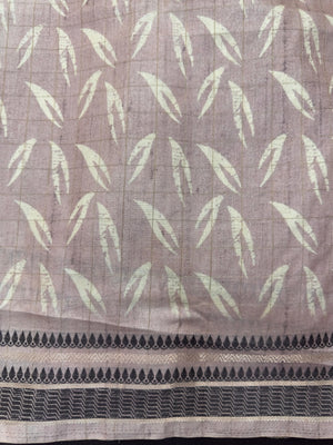 “Woman wearing a lightweight Tussar silk saree in earthy tones, featuring a soft natural sheen and subtle patterns—ideal for elegant daily wear.”