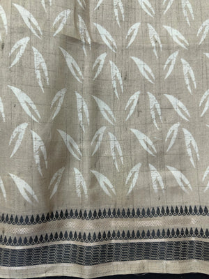 “Woman wearing a lightweight Tussar silk saree in earthy tones, featuring a soft natural sheen and subtle patterns—ideal for elegant daily wear.”