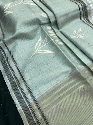 “Woman wearing a lightweight Tussar silk saree in earthy tones, featuring a soft natural sheen and subtle patterns—ideal for elegant daily wear.”