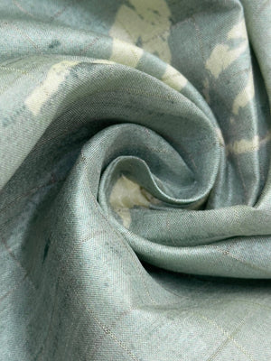 “Woman wearing a lightweight Tussar silk saree in earthy tones, featuring a soft natural sheen and subtle patterns—ideal for elegant daily wear.”