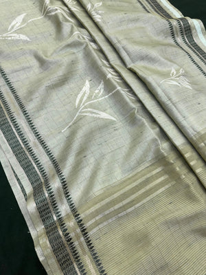 “Woman wearing a lightweight Tussar silk saree in earthy tones, featuring a soft natural sheen and subtle patterns—ideal for elegant daily wear.”