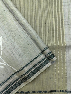 “Woman wearing a lightweight Tussar silk saree in earthy tones, featuring a soft natural sheen and subtle patterns—ideal for elegant daily wear.”